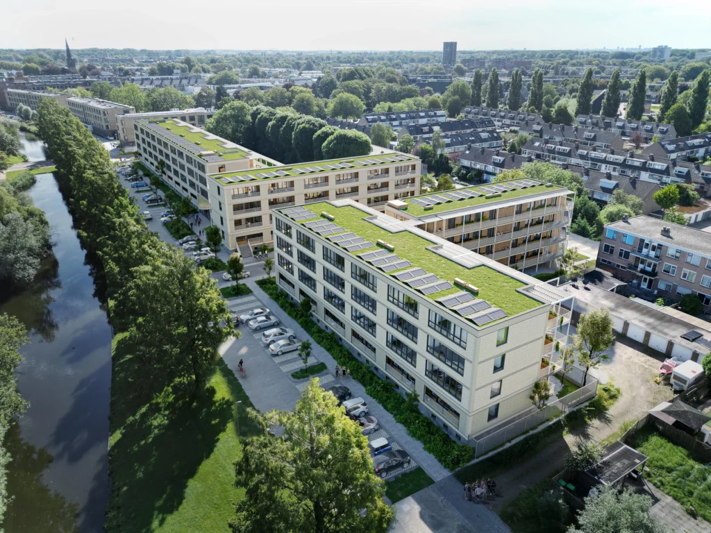 Rembrandtweg render van de wooncomplexen met sedumdak en zonnepanelen aan het water